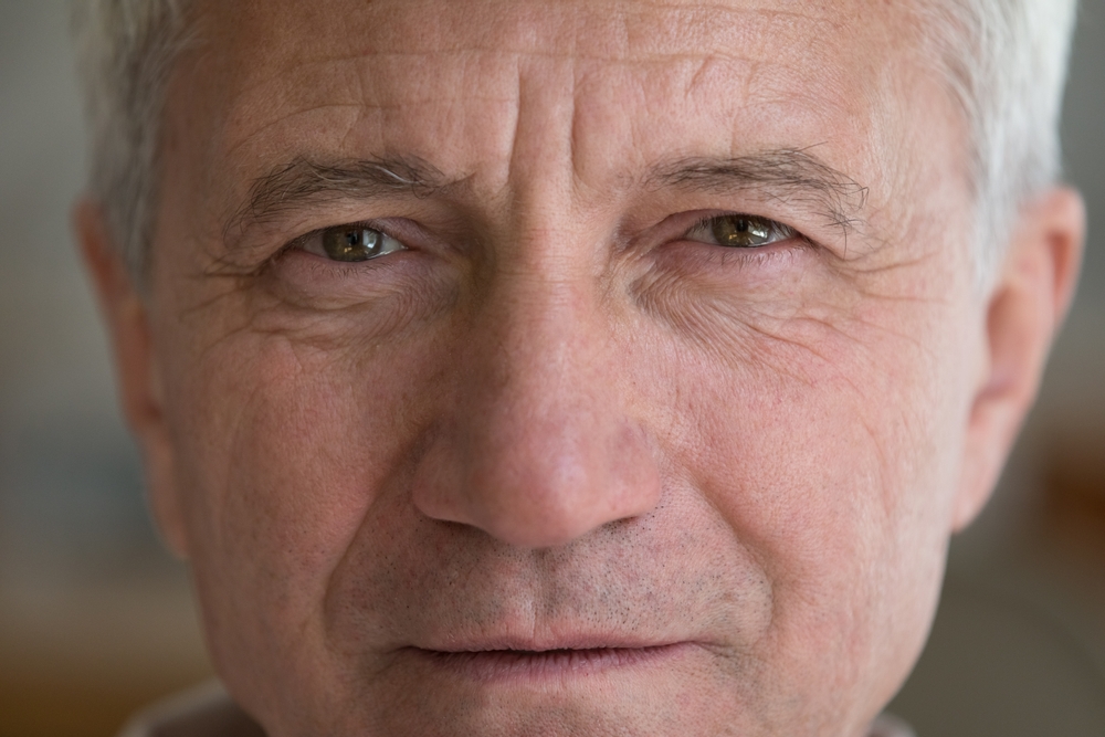 Face,Of,Serious,Mature,Elder,Man,With,Brown,Eyes,,Wrinkles. | Look Natural Micropigmentation Clinic Older man with natural eyebrows looking into the camera.