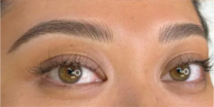 Woman’s natural eyebrows before micropigmentation treatment.